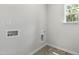 Laundry room with window, built-in shelving and hookups at 152 Greenwich Dr, Sanford, NC 27330