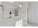 Double vanity bathroom with a large mirror and separate shower at 154 Tennyson Dr, Garner, NC 27529