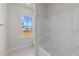 Bathroom with a shower/tub combo and window at 154 Tennyson Dr, Garner, NC 27529