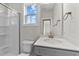 Bathroom with vanity, shower, and a window at 154 Tennyson Dr, Garner, NC 27529