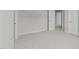 Well-lit bedroom with carpet and doors to other rooms at 154 Tennyson Dr, Garner, NC 27529