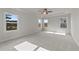 Bright and airy bedroom with large windows and ceiling fan at 154 Tennyson Dr, Garner, NC 27529