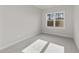 Well-lit bedroom with carpet and a window at 154 Tennyson Dr, Garner, NC 27529