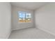 Spacious bedroom with large window and carpet flooring at 154 Tennyson Dr, Garner, NC 27529