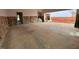Spacious garage with unfinished walls, offering ample space for parking and storage at 154 Tennyson Dr, Garner, NC 27529