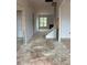 Living room and staircase await renovation, offering plenty of sunlight at 154 Tennyson Dr, Garner, NC 27529