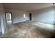 Unfinished living room featuring open archways to other rooms and lots of natural light at 154 Tennyson Dr, Garner, NC 27529