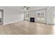 Living room featuring hardwood floors, fireplace and ceiling fan at 154 Tennyson Dr, Garner, NC 27529
