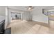 Open living room with hardwood floors, kitchen view, and fireplace at 154 Tennyson Dr, Garner, NC 27529