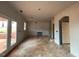 Unfinished living room featuring open archways to other rooms and lots of natural light at 154 Tennyson Dr, Garner, NC 27529
