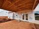 Covered patio with an open door leading to the backyard at 154 Tennyson Dr, Garner, NC 27529