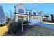 Charming two-story home featuring a white exterior, covered front porch, and attached two car garage at 1709 Chestnut Falls Rd, Wendell, NC 27591