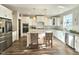 Beautiful kitchen featuring white cabinets, granite countertops, stainless steel appliances, and a central island at 1709 Chestnut Falls Rd, Wendell, NC 27591