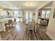 Spacious open concept kitchen and dining area featuring modern appliances, wood floors, and natural light at 1709 Chestnut Falls Rd, Wendell, NC 27591