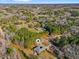 Aerial view of a home nestled among the trees on a large lot at 1801 Amethyst Ridge Dr, Raleigh, NC 27604