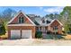 Brick home with two-car garage and landscaped yard at 1801 Amethyst Ridge Dr, Raleigh, NC 27604