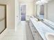 Double vanity bathroom with marble countertop and tiled floor at 2045 Shotwell Rd, Clayton, NC 27520