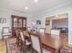 Bright dining room featuring hardwood floors and a china cabinet at 250 Kentview Dr, Pittsboro, NC 27312