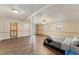 Bright bedroom with wood-look floors and a comfortable bed at 253 Ronald Tharrington Rd, Louisburg, NC 27549