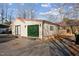 Detached garage with large glass door and ample parking space at 253 Ronald Tharrington Rd, Louisburg, NC 27549
