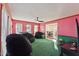 Relaxing Gathering room featuring a ceiling fan and plush seating at 253 Ronald Tharrington Rd, Louisburg, NC 27549