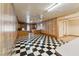 Checkerboard floor kitchen with wood cabinets and appliances at 253 Ronald Tharrington Rd, Louisburg, NC 27549