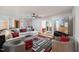 Bright living room with sectional sofa, large TV, and fireplace at 253 Ronald Tharrington Rd, Louisburg, NC 27549