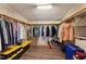 Spacious walk-in closet with ample storage shelving and hanging space at 253 Ronald Tharrington Rd, Louisburg, NC 27549