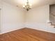 Bright dining room features hardwood floors and wainscoting at 263 Meadow Beauty Dr, Apex, NC 27539