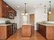 Open kitchen boasts granite countertops and stainless steel appliances at 263 Meadow Beauty Dr, Apex, NC 27539