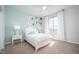 Bedroom with white bed frame, floral wall art and carpet flooring at 2790 Farmhouse Dr, Apex, NC 27502