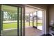 Screened porch with wood decking and sliding glass doors offers backyard access at 2790 Farmhouse Dr, Apex, NC 27502