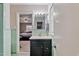 Bathroom featuring a view of a bedroom and a vanity at 302 S Pine St, Benson, NC 27504