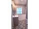 This bathroom features new flooring, a vanity with drawers and cabinets, and neutral paint at 302 S Pine St, Benson, NC 27504