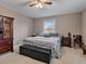 Cozy bedroom with a neutral color scheme, a ceiling fan, and ample space at 302 S Pine St, Benson, NC 27504