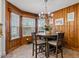 Charming dining area with wood paneling, large windows, and a cozy atmosphere at 302 S Pine St, Benson, NC 27504