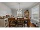 Elegant dining room with a large table, chandelier, and ample seating for gatherings at 302 S Pine St, Benson, NC 27504