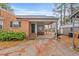 Charming brick home featuring a covered front entrance and well-maintained landscaping at 302 S Pine St, Benson, NC 27504