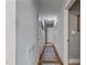 Hallway featuring hard wood floors and neutral walls at 302 S Pine St, Benson, NC 27504