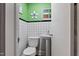 Powder room featuring white tile and fixtures at 302 S Pine St, Benson, NC 27504