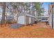 Exterior shot of shed in backyard featuring a roll-up door at 302 S Pine St, Benson, NC 27504