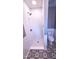 This shower features subway tiling, a dark faucet, and black and white patterned floor at 302 S Pine St, Benson, NC 27504