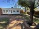 Spacious backyard with patio and large tree at 307 Westfield Dr, Dunn, NC 28334