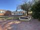 A house backyard with a brick patio, garden boxes, trees, and a partial view of the home at 307 Westfield Dr, Dunn, NC 28334