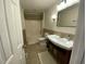 Updated bathroom with vanity, toilet, and bathtub at 307 Westfield Dr, Dunn, NC 28334