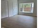 Bedroom featuring natural light from bay window and closet storage at 307 Westfield Dr, Dunn, NC 28334
