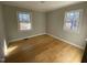 Bedroom featuring hardwood floors, bright natural light, and neutral paint at 307 Westfield Dr, Dunn, NC 28334