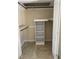 This closet has shelving units, hanging rods, and tile flooring at 307 Westfield Dr, Dunn, NC 28334
