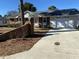 House exterior featuring a brick facade and attached garage at 307 Westfield Dr, Dunn, NC 28334