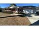 Brick ranch home with attached garage and well-maintained lawn at 307 Westfield Dr, Dunn, NC 28334